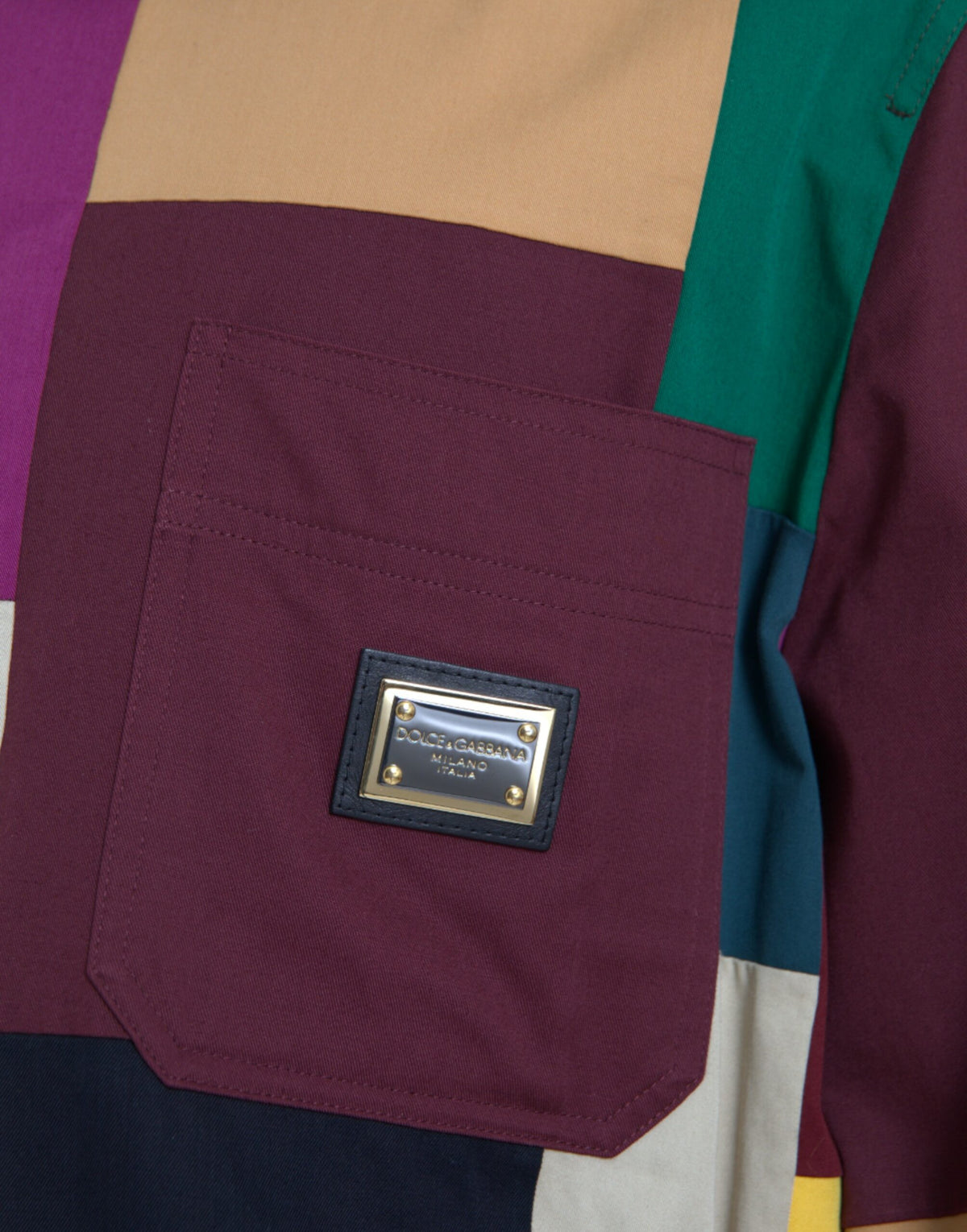 Discover the Dolce & Gabbana Multicolor Patchwork Cotton Collared Jacket, a masterpiece of Italian craftsmanship that embodies luxury and sophistication for the discerning individual.