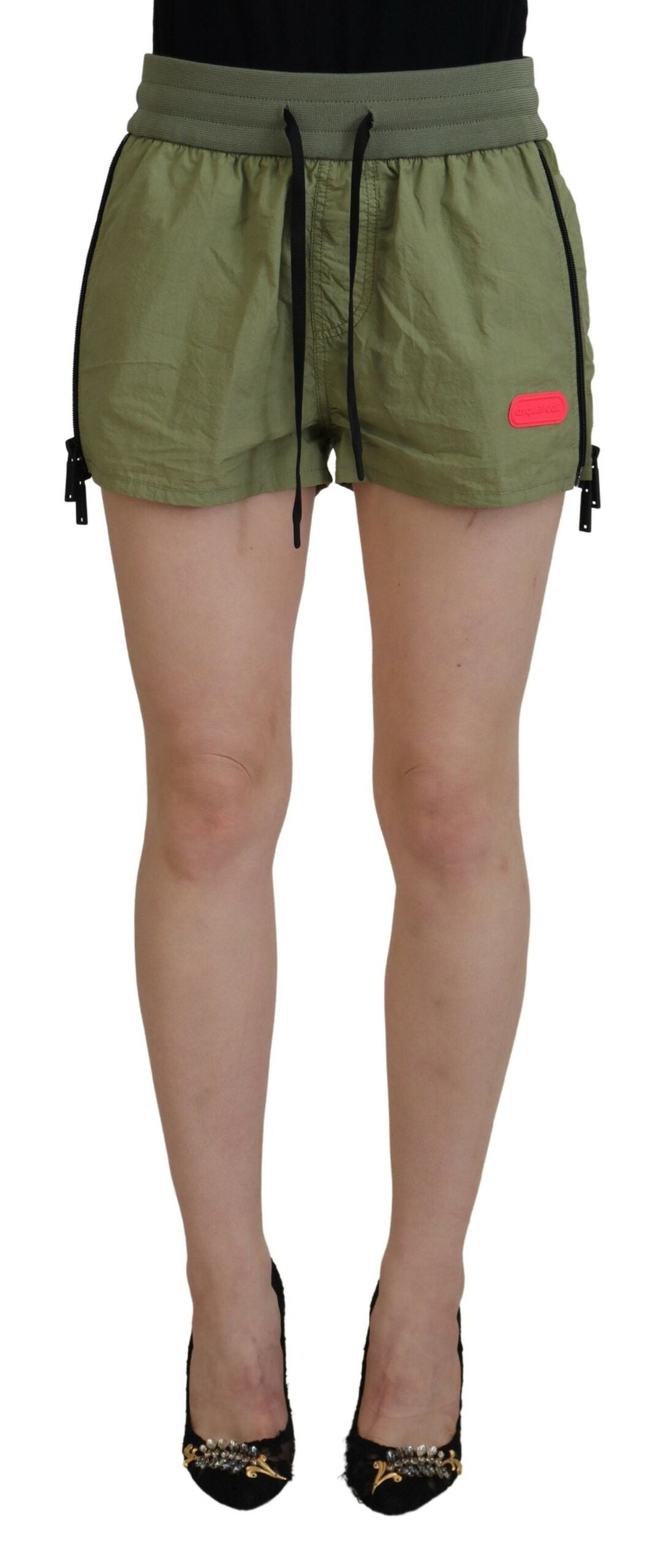 Indulge in the exquisite craftsmanship of Dsquared²'s Green Cotton Mid Waist Drawstring Tapered Shorts, where timeless elegance meets luxurious comfort for the discerning individual.