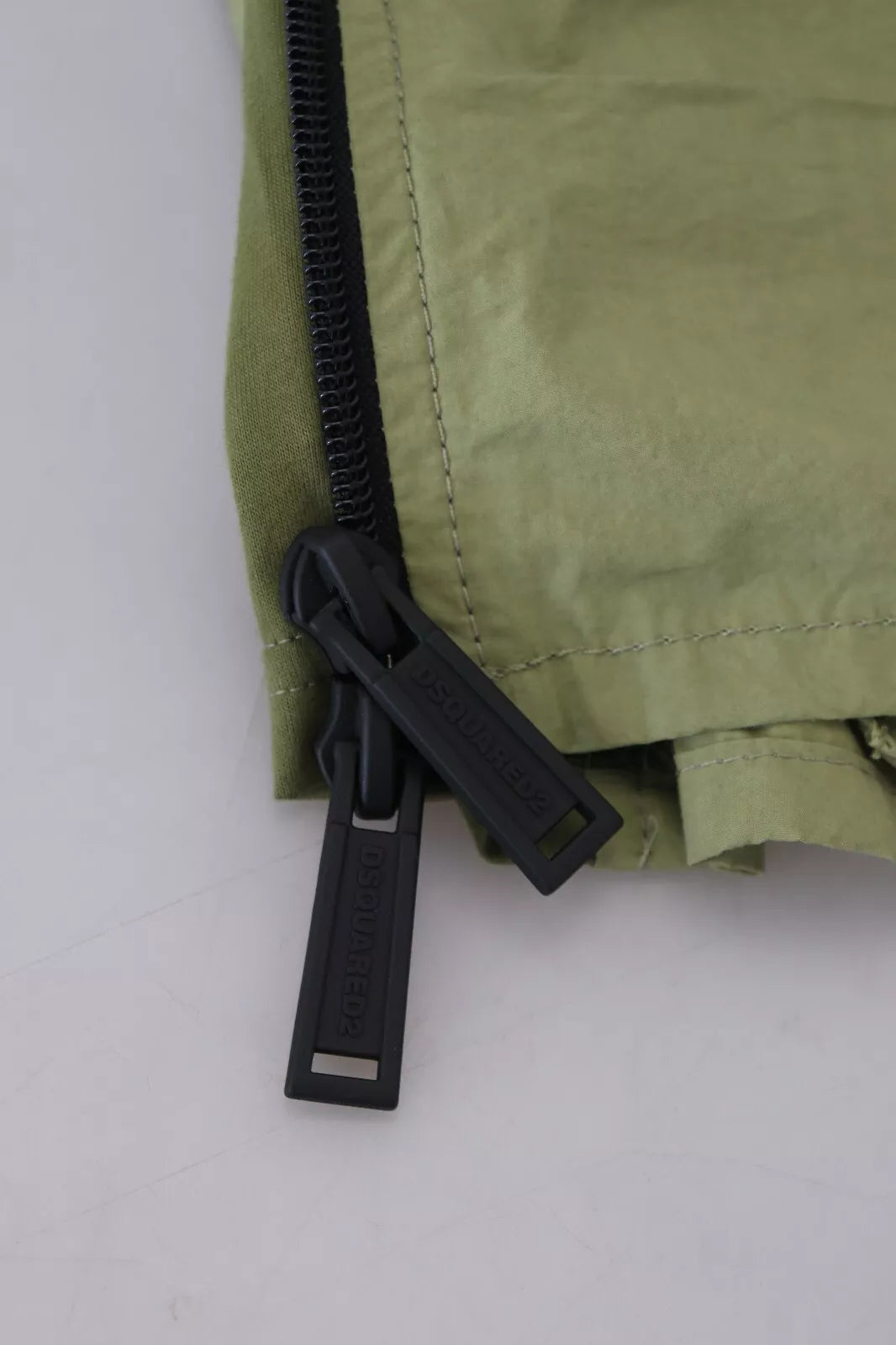 Indulge in the exquisite Dsquared² Green Cotton Mid Waist Drawstring Tapered Shorts, where Italian craftsmanship meets timeless elegance for a sophisticated allure.