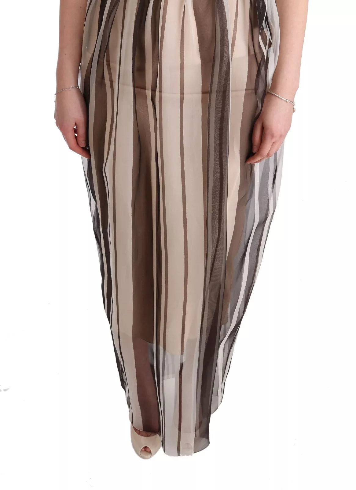 Indulge in the exquisite Dolce & Gabbana Beige Brown Striped Silk Sheath Dress, a timeless masterpiece of Italian craftsmanship that embodies luxurious elegance and sophistication.