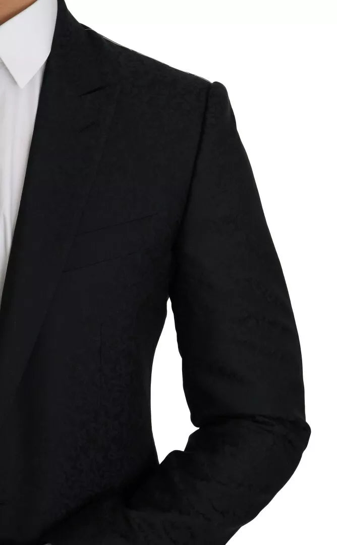 Discover the Dolce & Gabbana Blue Jacquard Slim Floral Jacket Blazer, a masterpiece of Italian craftsmanship blending luxurious wool and silk for timeless elegance.