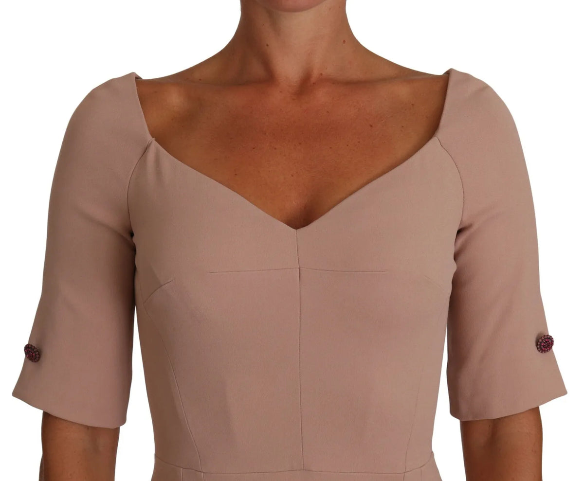 Indulge in the exquisite allure of the Dolce & Gabbana Dusty Pink Midi Sheath Dress, a masterpiece of Italian craftsmanship that embodies luxury and sophistication.