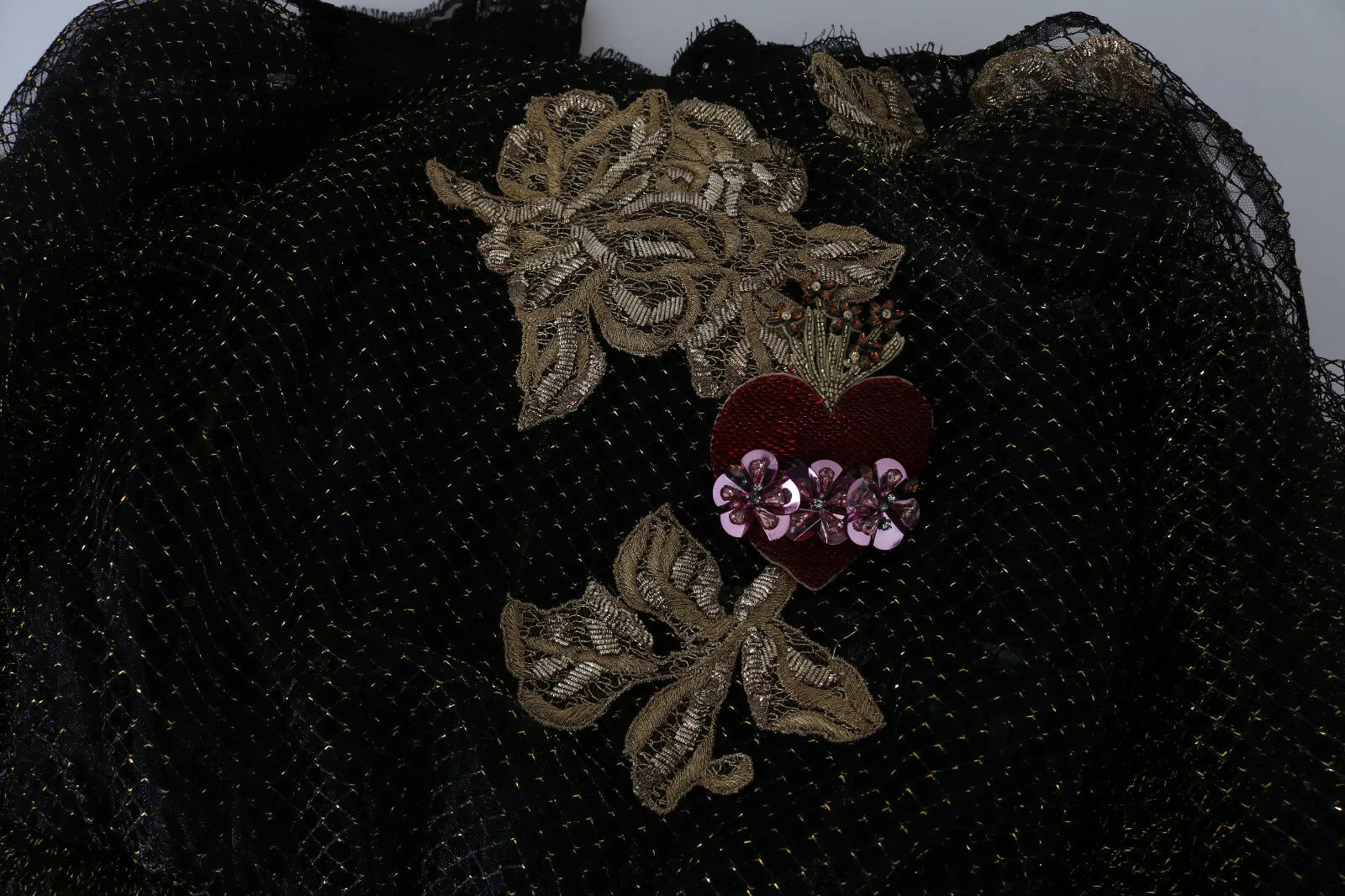 Indulge in the exquisite allure of the Dolce & Gabbana Black Gold Crystal Heart A-line Dress, where luxurious silk and intricate Baroque embroidery redefine elegance.