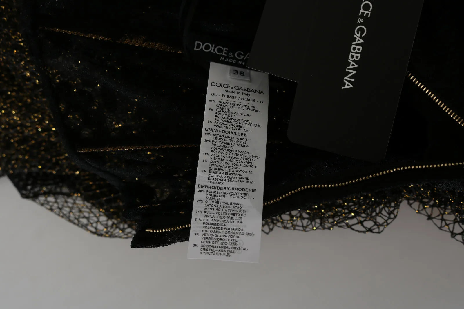 Indulge in the allure of the Dolce & Gabbana Black Gold Crystal Heart A-line Dress, where exquisite Baroque embroidery and luxurious silk create an unforgettable statement of elegance.
