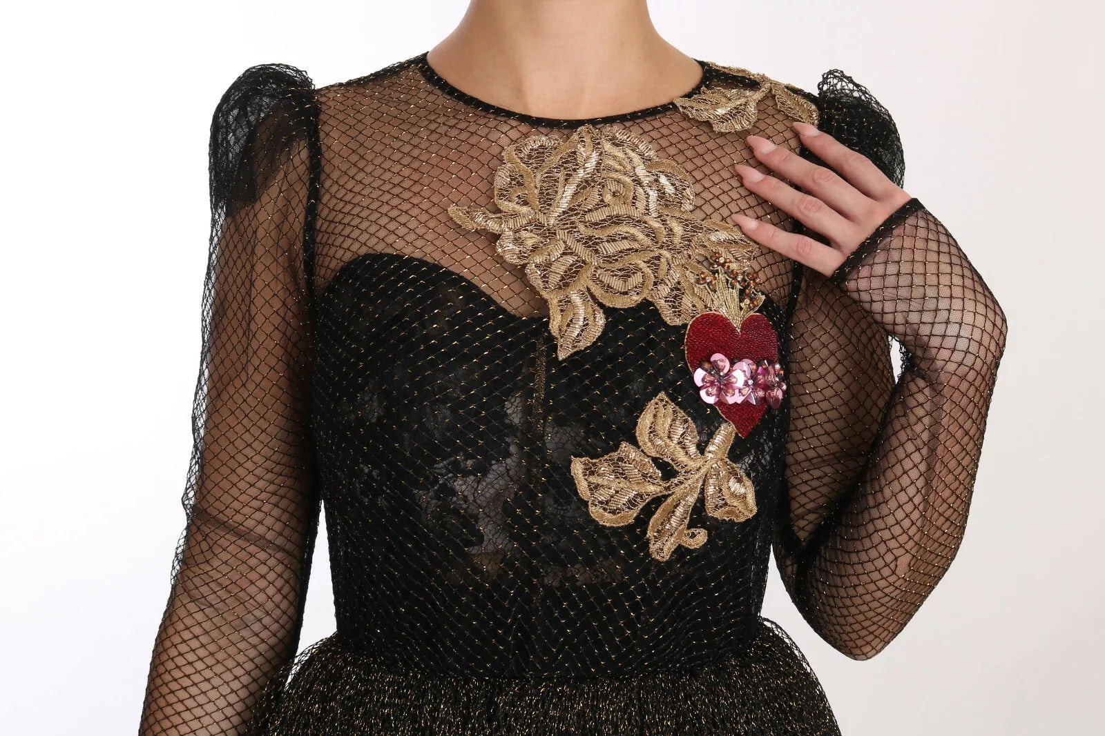 Indulge in the exquisite allure of the Dolce & Gabbana Black Gold Crystal Heart A-line Dress, where luxurious silk and Baroque embroidery redefine timeless elegance.