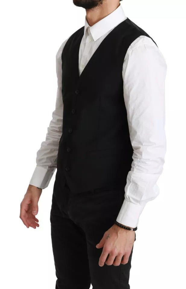 Elevate your wardrobe with the Dolce & Gabbana Black Wool Stretch Waistcoat, a masterpiece of Italian craftsmanship that embodies timeless elegance and sophistication.