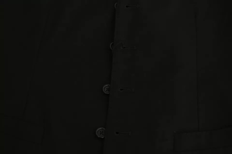 Elevate your wardrobe with the Dolce & Gabbana Black Wool Stretch Waistcoat, a masterpiece of Italian craftsmanship that embodies timeless elegance and sophisticated allure.