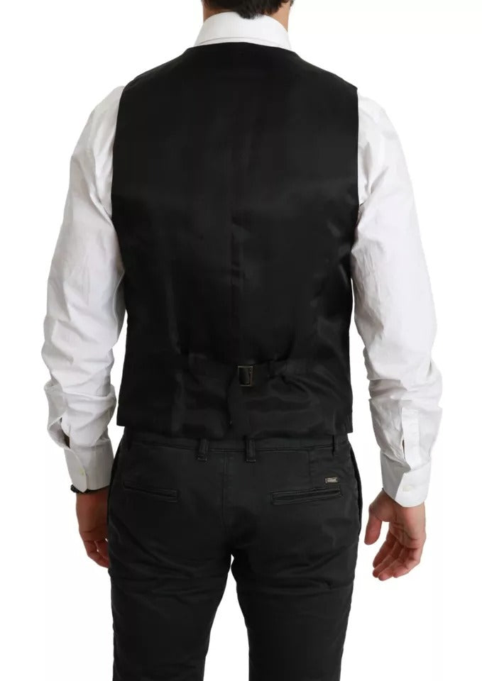 Elevate your elegance with the Dolce & Gabbana Black Wool Stretch Waistcoat, a masterpiece of Italian craftsmanship that embodies timeless sophistication and luxury.