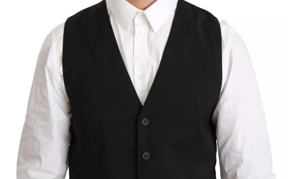Elevate your elegance with the Dolce & Gabbana Black Wool Stretch Waistcoat, a timeless piece crafted in Italy, embodying luxurious sophistication and exquisite craftsmanship.