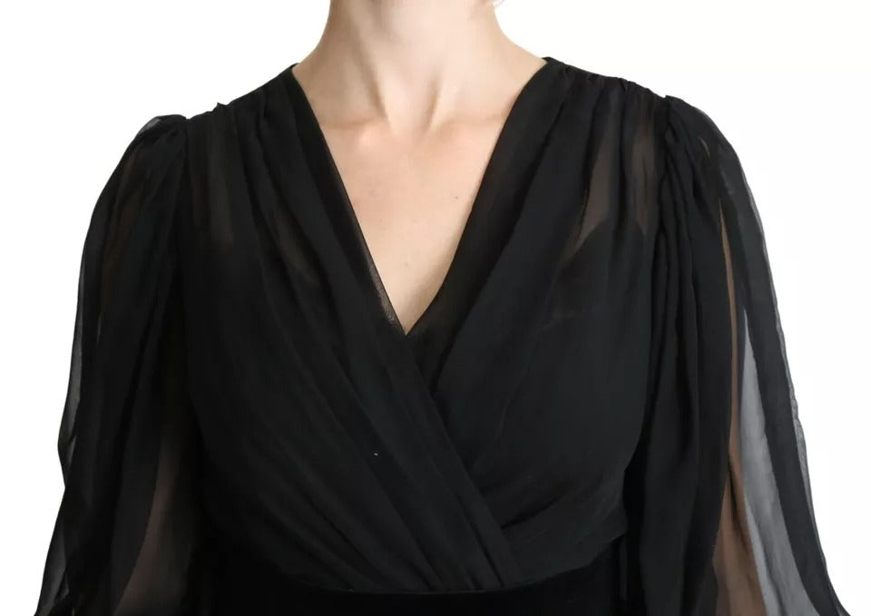 Indulge in the exquisite craftsmanship of the Dolce & Gabbana Black Mesh Pleated Mini Silk Blend Dress, a timeless piece that elevates elegance and allure for every occasion.