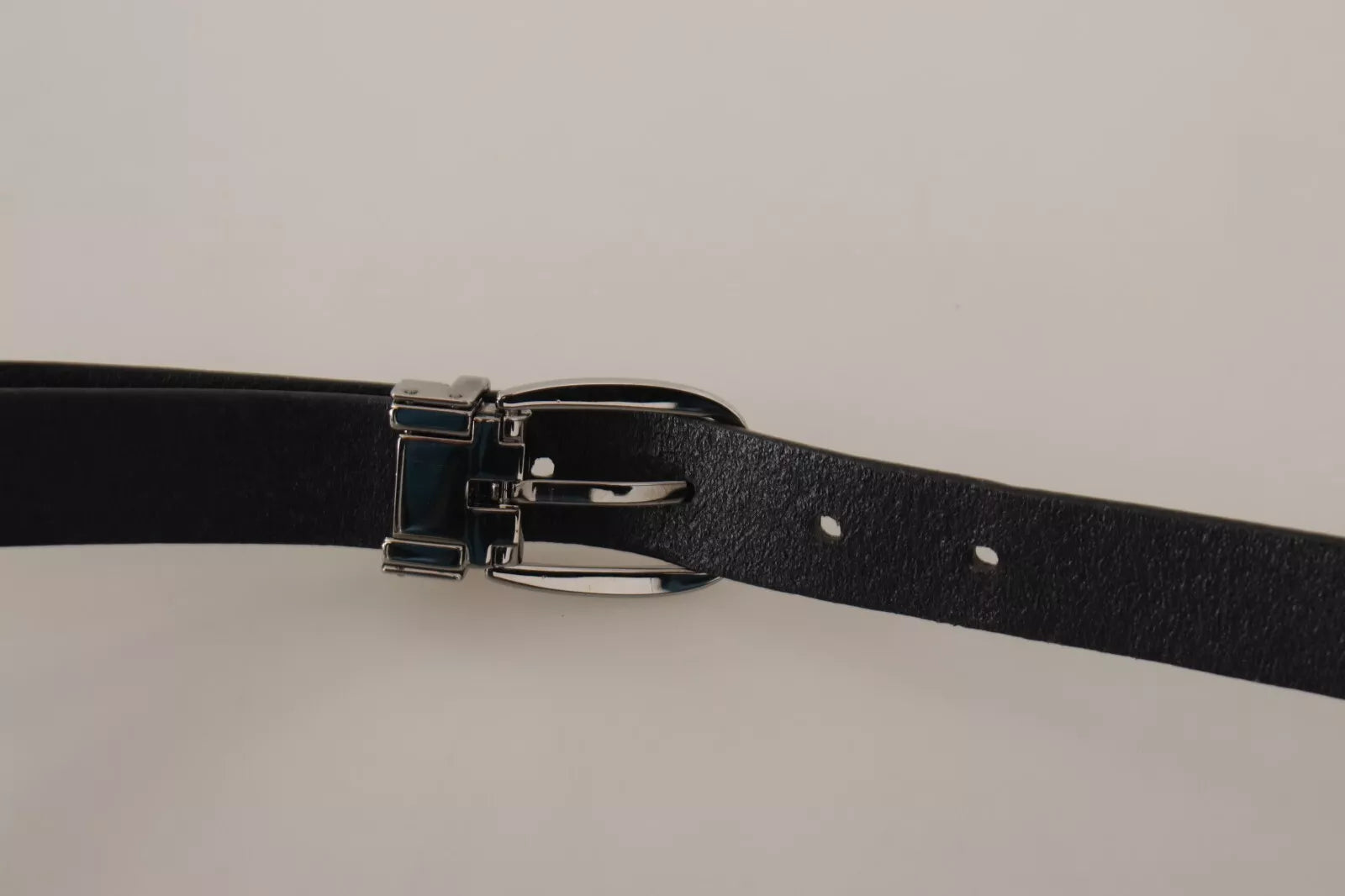 Indulge in the exquisite allure of the Dolce & Gabbana Black Classic Leather Belt, a testament to Italian craftsmanship that elevates every ensemble with timeless sophistication.