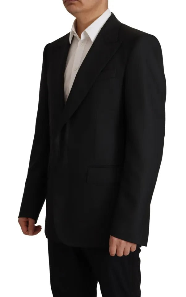 Indulge in the exquisite allure of the Dolce & Gabbana Black Polyester Single Breasted Blazer, a timeless piece crafted in Italy, embodying luxury and sophistication for the discerning individual.