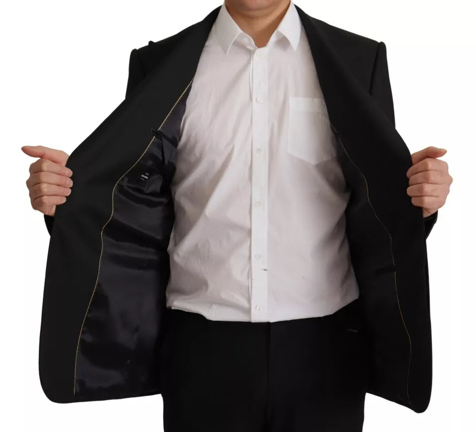 Discover the exquisite Dolce & Gabbana Black Polyester Single Breasted Blazer, a timeless piece of Italian craftsmanship that embodies luxury and sophistication.