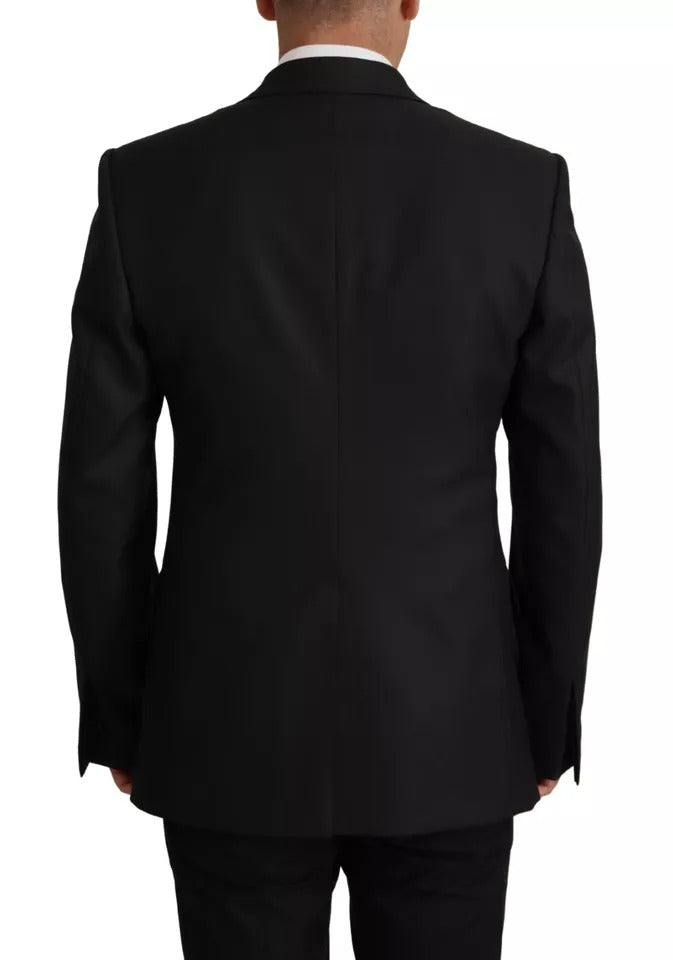 Elevate your wardrobe with the Dolce & Gabbana Black Polyester Single Breasted Blazer, a timeless piece of Italian craftsmanship that embodies luxury and sophistication.