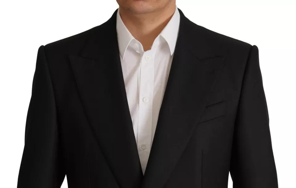 Elevate your wardrobe with the Dolce & Gabbana Black Polyester Single Breasted Blazer, a masterpiece of Italian craftsmanship that embodies timeless elegance and luxury.
