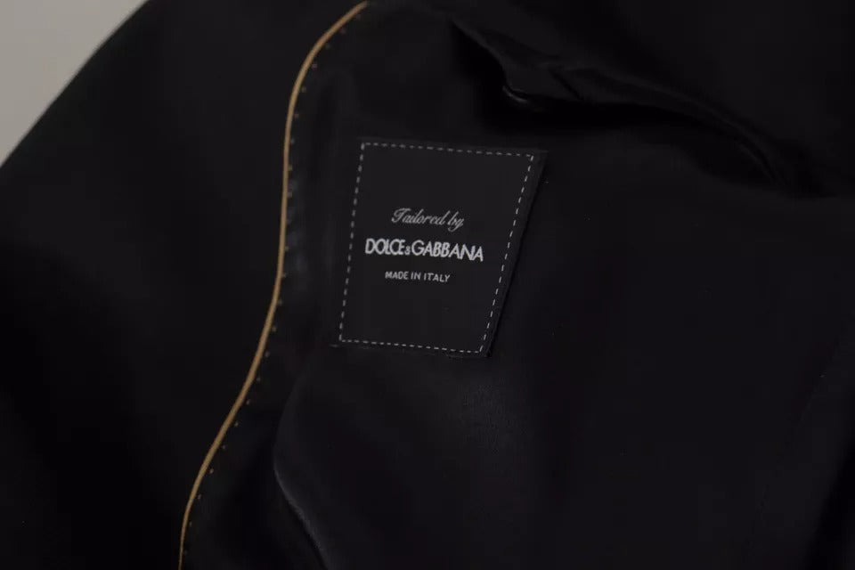 Discover the Dolce & Gabbana Black Polyester Single Breasted Blazer, a timeless piece of Italian craftsmanship that embodies luxury and sophistication for the discerning individual.