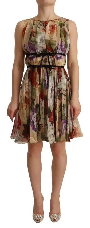 Indulge in the exquisite Dolce & Gabbana beige floral silk mini dress, a masterpiece of Italian craftsmanship that embodies timeless elegance and sophisticated allure.