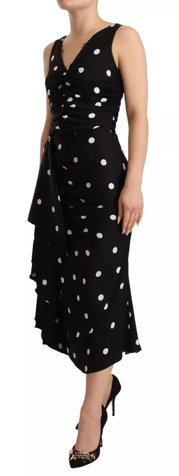 Discover the exquisite Dolce & Gabbana Black Silk Polka Dots V-neck Sheath Midi Dress, a timeless piece crafted in Italy, embodying elegance and sophistication for the discerning individual.