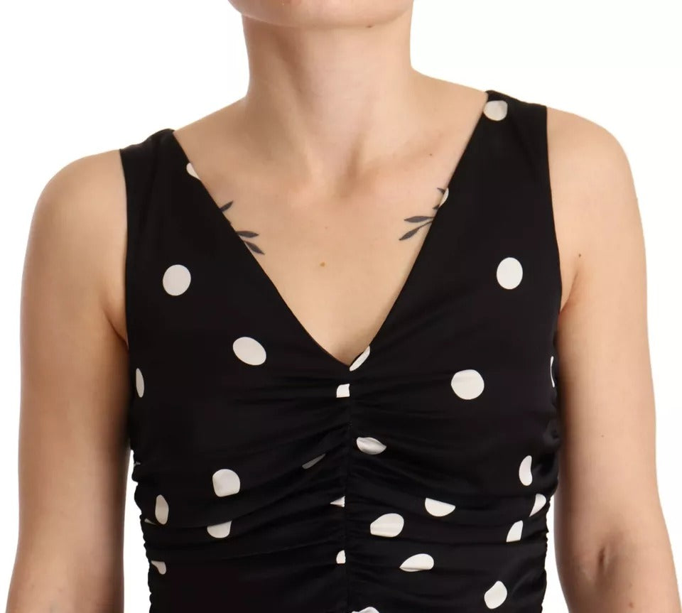 Indulge in the exquisite Dolce & Gabbana Black Silk Polka Dots V-neck Sheath Midi Dress, a timeless masterpiece that embodies luxury and sophistication for the discerning individual.