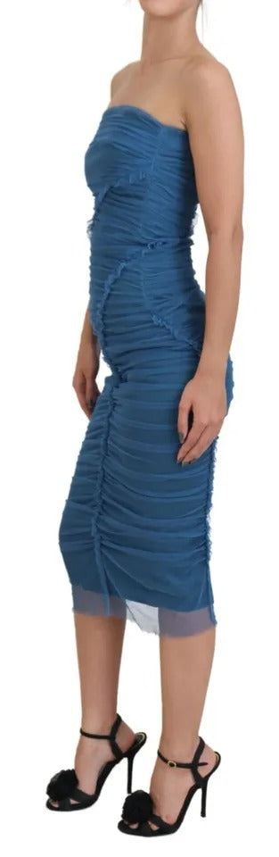 Experience the epitome of luxury with the Dolce & Gabbana Blue Mesh Trim Ruched Tulle Sheath Dress, a timeless piece crafted in Italy to elevate your elegance.
