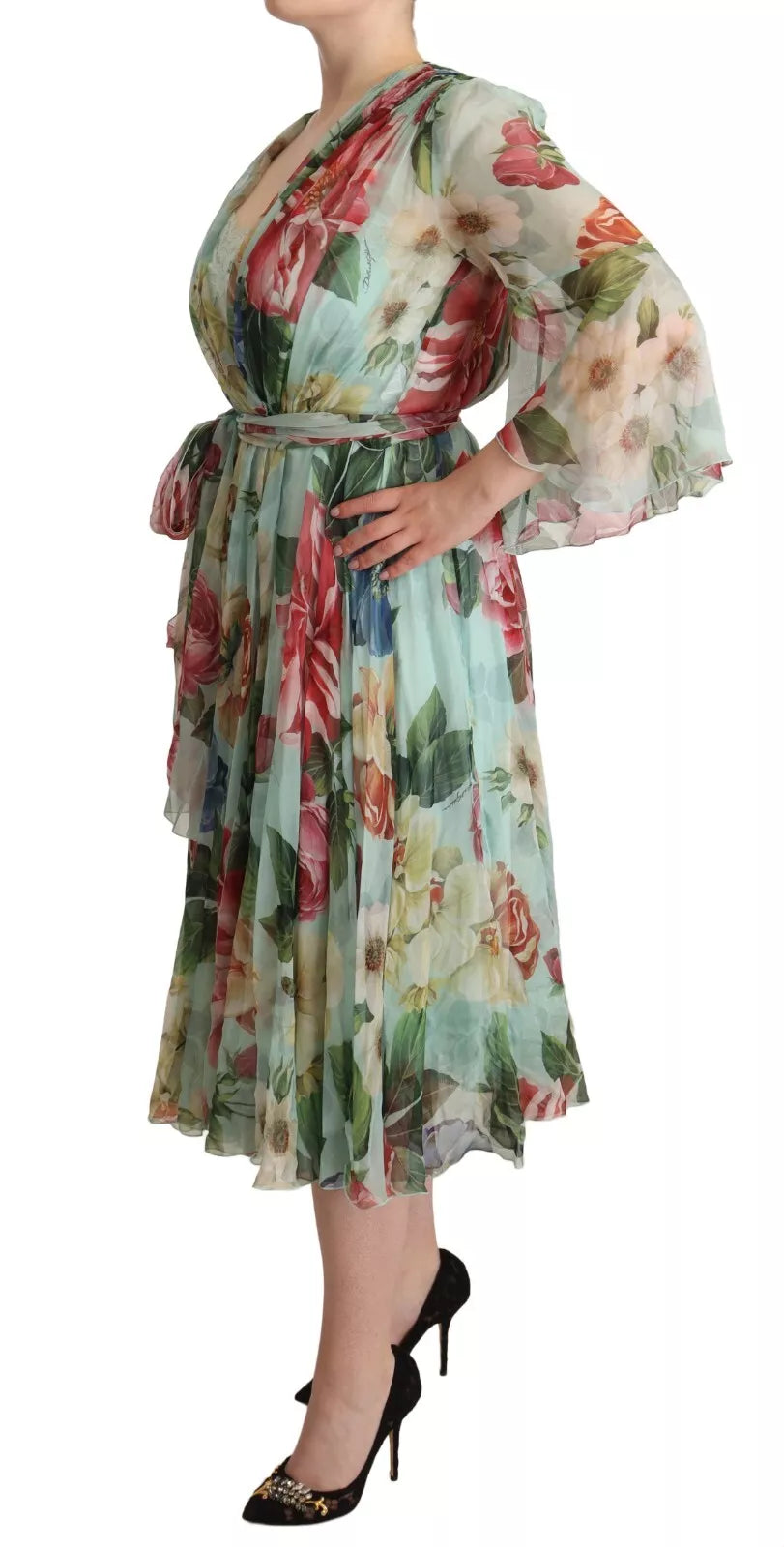 Elevate your wardrobe with the Dolce & Gabbana Green Floral Long Sleeve V-neck Midi Dress, a silk masterpiece that embodies luxury and exquisite Italian craftsmanship.