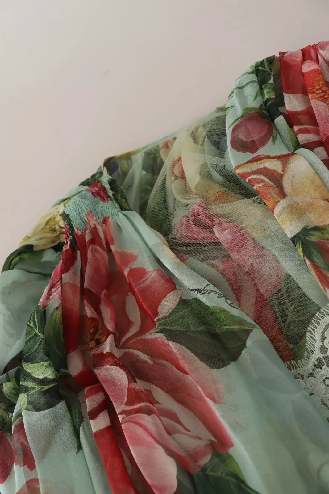 Indulge in the exquisite allure of the Dolce & Gabbana Green Floral Long Sleeve V-neck Midi Dress, a silk masterpiece that embodies luxury and sophisticated craftsmanship for unforgettable moments.