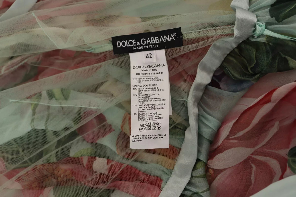 Indulge in the exquisite luxury of the Dolce & Gabbana Green Floral Long Sleeve V-neck Midi Dress, crafted from 100% silk, embodying elegance and timeless sophistication for any refined occasion.