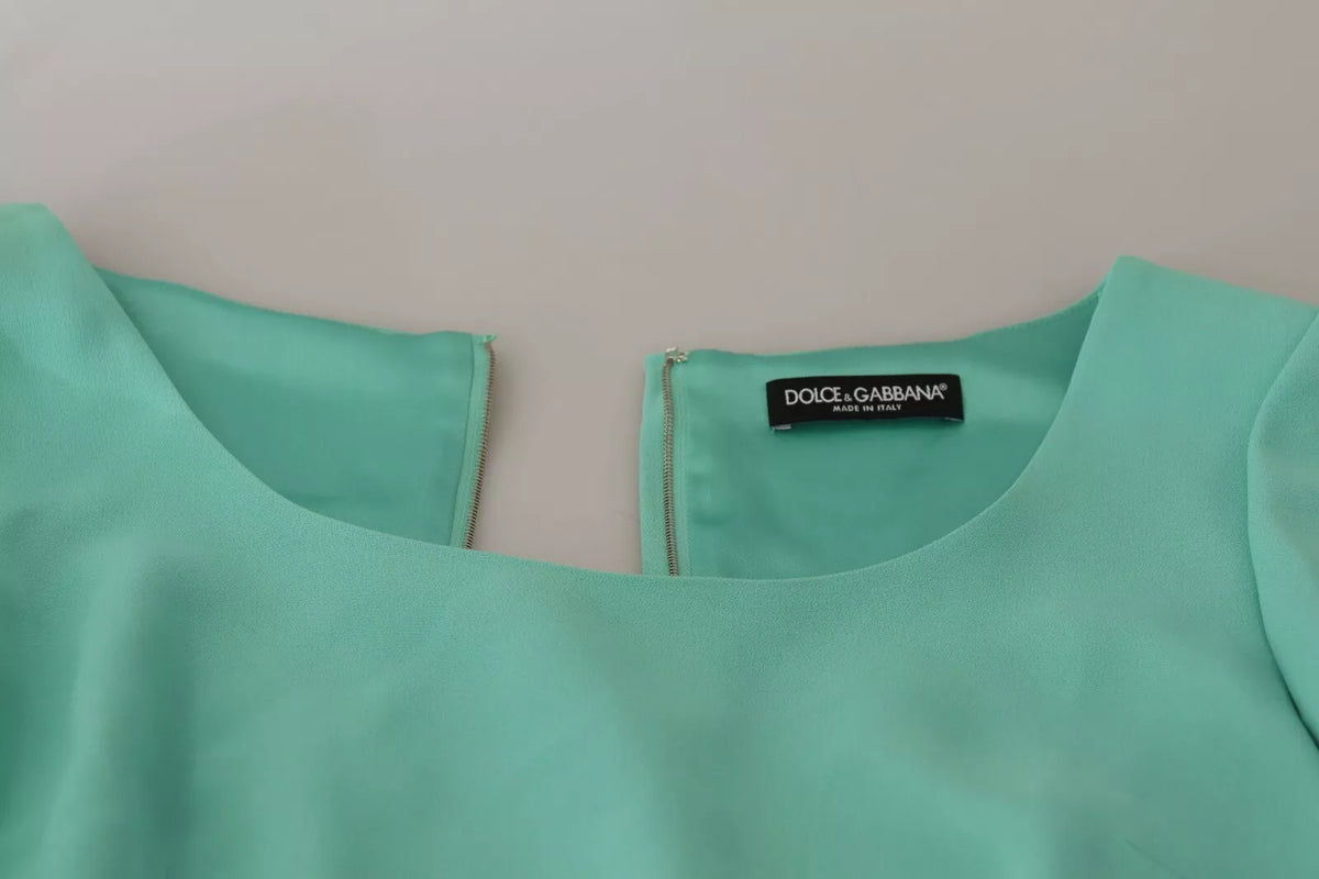 Elevate your elegance with the Dolce & Gabbana Mint Green Sheath Midi Dress, a luxurious blend of silk and rayon, embodying exquisite Italian craftsmanship for unforgettable moments.