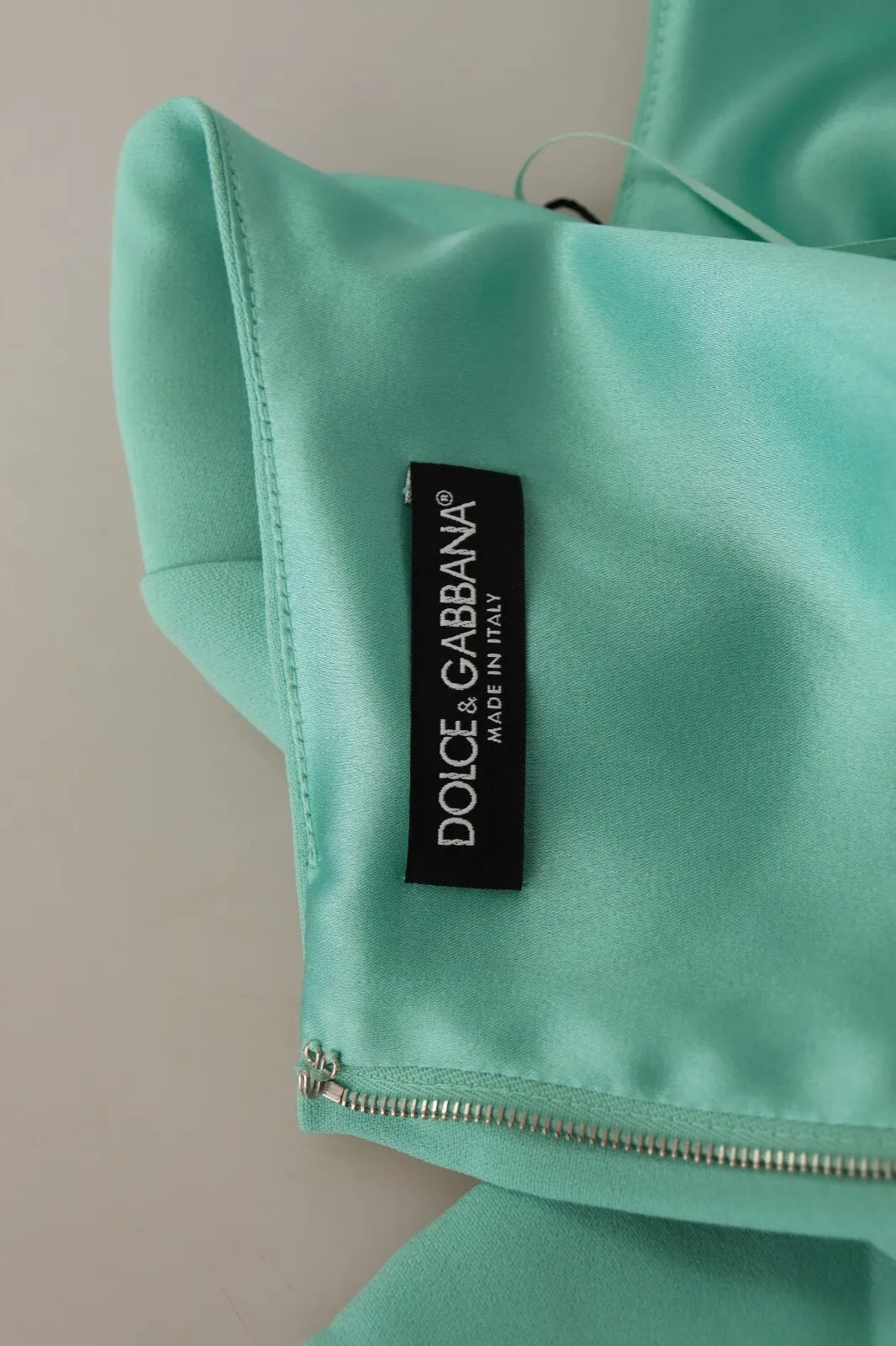 Elevate your wardrobe with the Dolce & Gabbana Mint Green Sheath Midi Dress, a masterpiece of exquisite craftsmanship and luxurious materials that embodies timeless elegance.