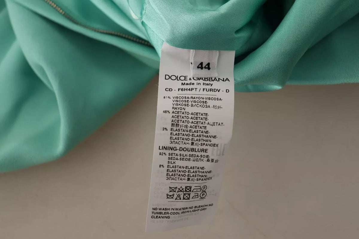 Indulge in the exquisite allure of the Dolce & Gabbana Mint Green Sheath Midi Dress, a masterpiece of luxury craftsmanship that embodies timeless elegance and sophistication.