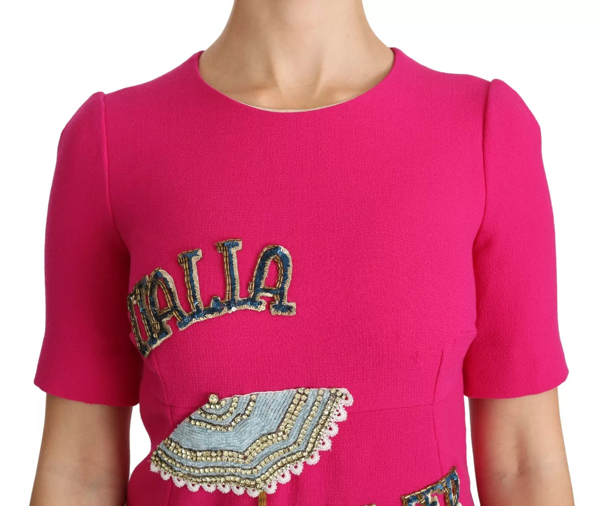 Experience the allure of the Dolce & Gabbana Pink Italia Forever Crystal Sheath Dress, crafted from luxurious wool and silk, embodying timeless elegance and exquisite craftsmanship for the discerning individual.