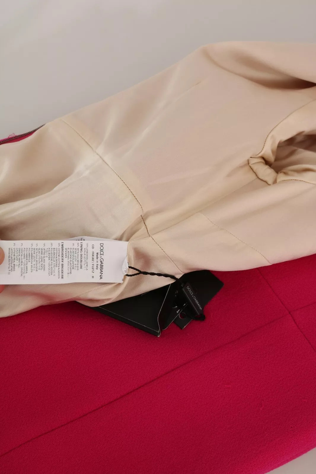 Indulge in the exquisite Dolce & Gabbana Pink Italia Forever Crystal Sheath Dress, a masterpiece of 100% wool and silk lining, embodying timeless elegance and luxurious craftsmanship.