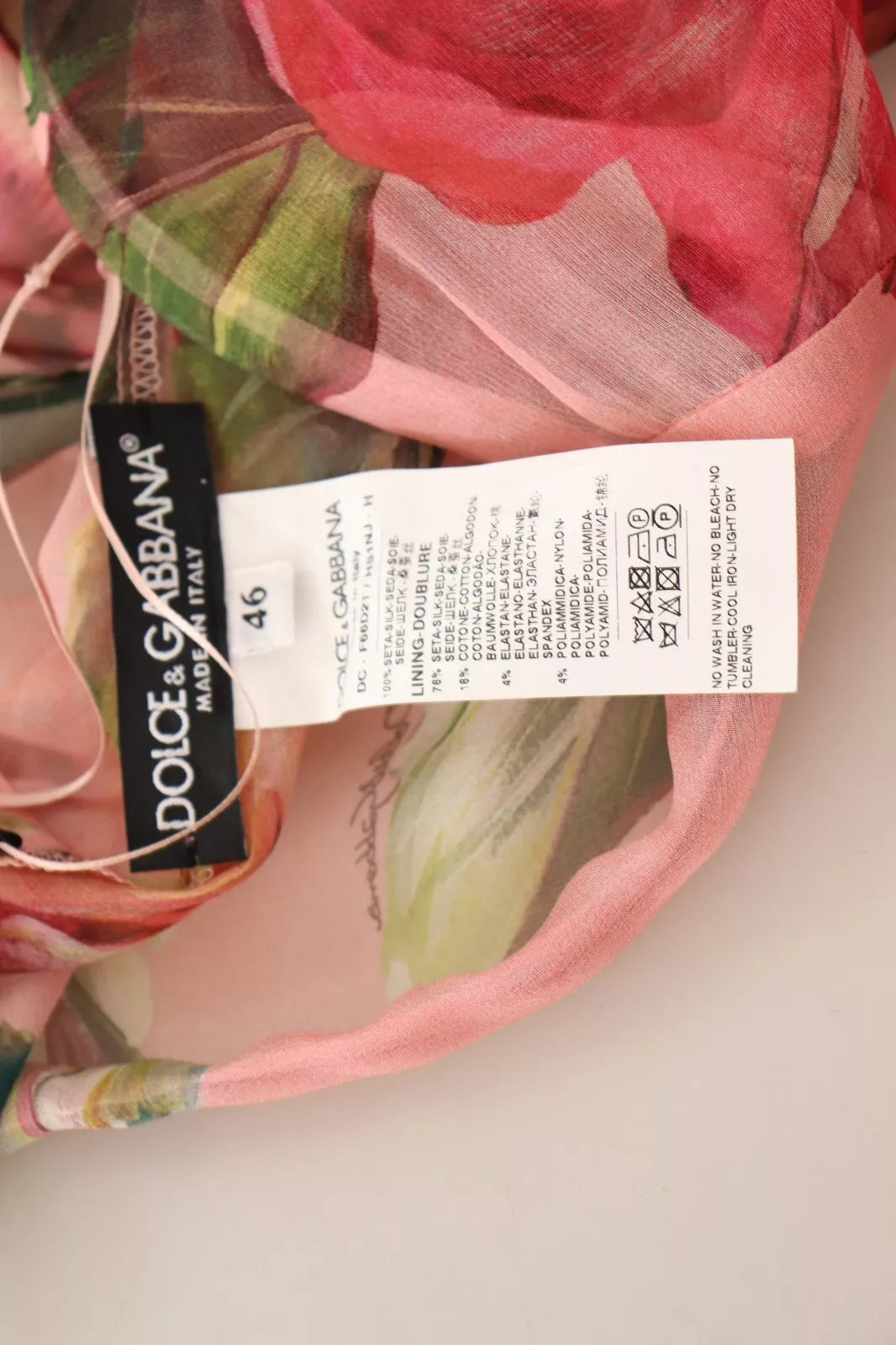 Experience the exquisite allure of Dolce & Gabbana's Pink Silk Floral Print Layered Maxi Dress, a luxurious embodiment of haute couture craftsmanship and timeless elegance.