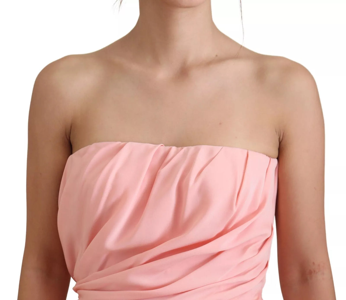 Indulge in the exquisite allure of the Dolce & Gabbana Pink Silk Stretch Strapless Sheath Dress, a testament to Italian craftsmanship that elevates your elegance for any occasion.