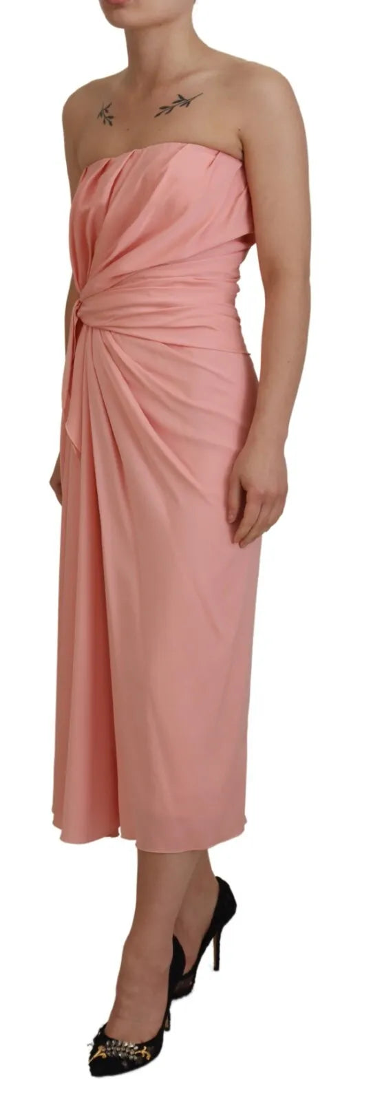 Experience the allure of the Dolce & Gabbana Pink Silk Stretch Strapless Sheath Midi Dress, a timeless embodiment of Italian craftsmanship and modern elegance.