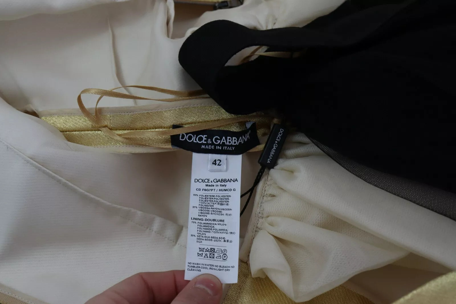 Discover the exquisite Dolce & Gabbana Gold Polyester Sleeveless A-line Tulle Dress, a timeless piece of Italian craftsmanship that embodies elegance and allure for every occasion.