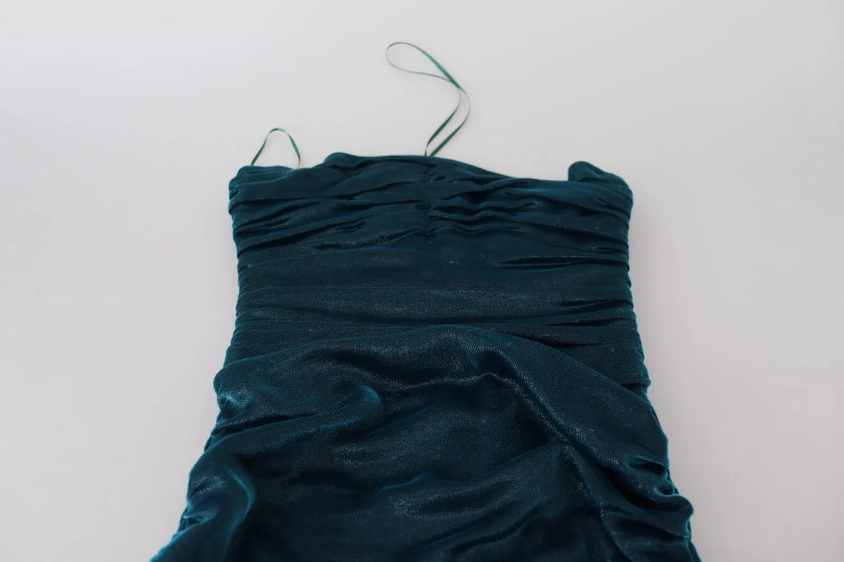 Indulge in the allure of the Dolce & Gabbana Silk Blend Blue Satin Strapless Dress, where exquisite craftsmanship meets timeless elegance, perfect for commanding attention at any occasion.