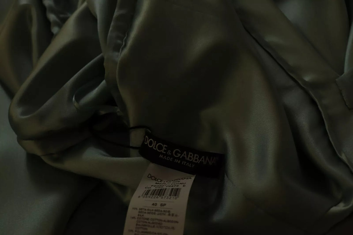Indulge in the exquisite Dolce & Gabbana Silk Mint Green One Shoulder Midi Dress, a timeless masterpiece of Italian craftsmanship that embodies luxury and elegance.