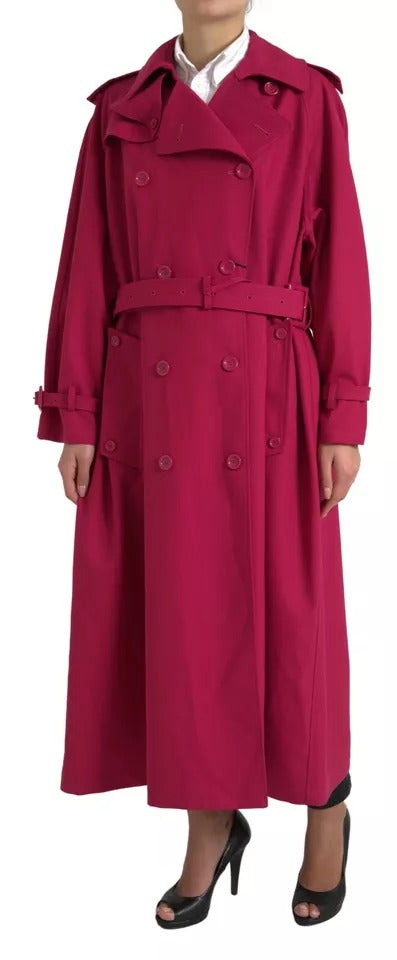 Indulge in the exquisite Dolce & Gabbana Dark Pink Double Breasted Trench Coat, a luxurious blend of polyester and virgin wool, crafted in Italy for timeless elegance and sophistication.