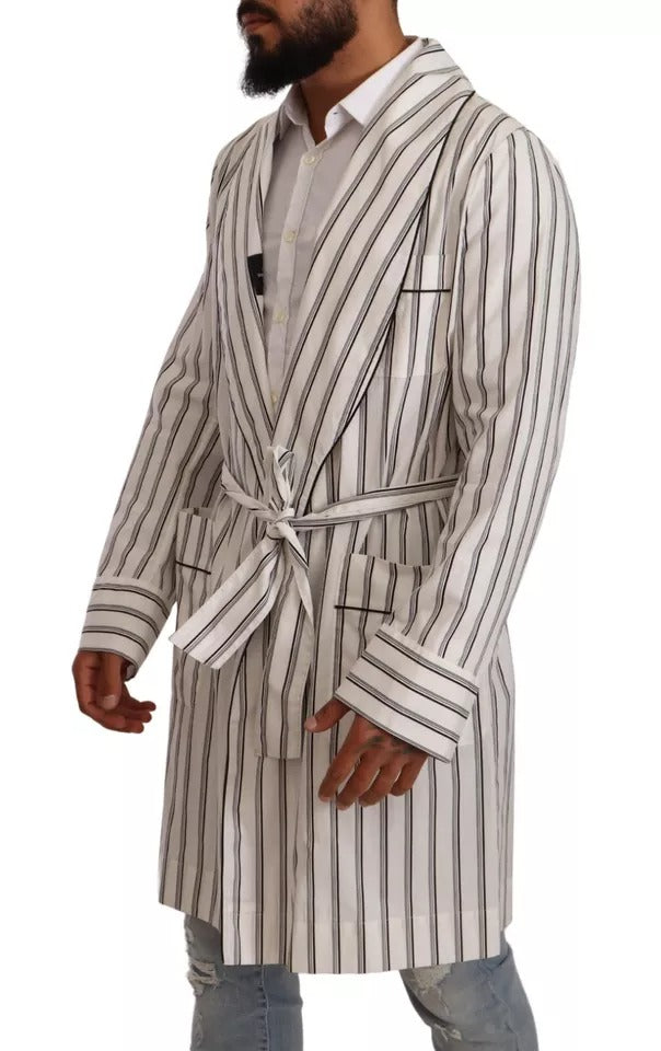 Elevate your wardrobe with the Dolce & Gabbana White Striped Cotton Robe Coat Wrap Jacket, a masterpiece of Italian craftsmanship that embodies timeless luxury and sophistication.