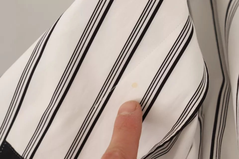 Indulge in the Dolce & Gabbana White Striped Cotton Robe Coat Wrap Jacket, a masterpiece of Italian craftsmanship that embodies timeless elegance and luxurious allure.