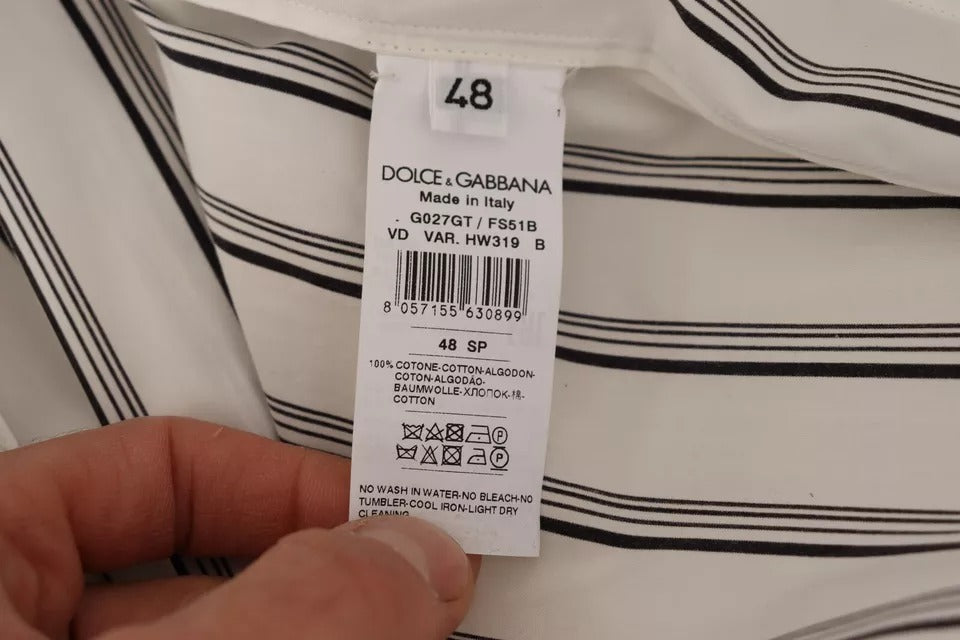 Elevate your wardrobe with the Dolce & Gabbana White Striped Cotton Robe Coat Wrap Jacket, a masterpiece of Italian craftsmanship that embodies timeless elegance and luxurious comfort.