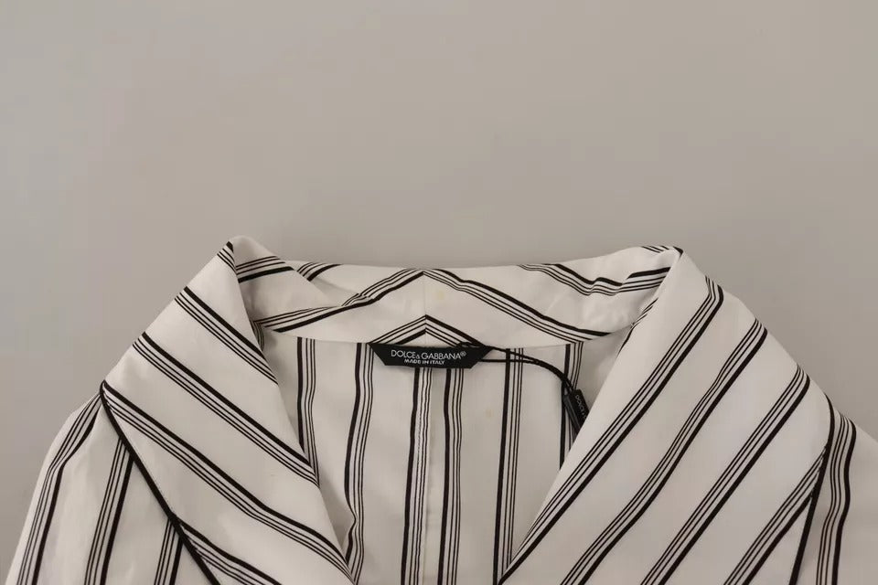 Elevate your wardrobe with the Dolce & Gabbana White Striped Cotton Robe Coat, a masterpiece of Italian craftsmanship that embodies timeless elegance and luxurious comfort.