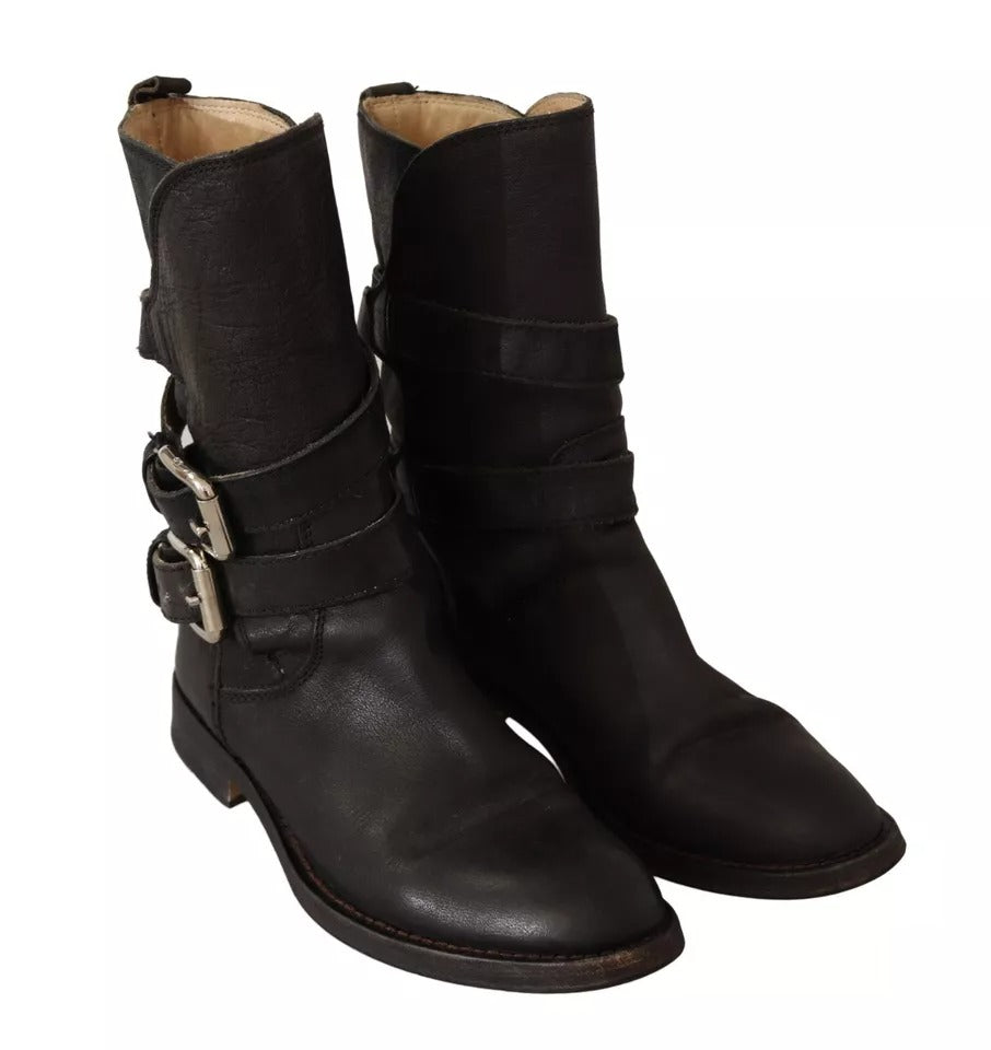 Elevate your style with Dolce & Gabbana's Black Leather Buckle Mid Calf Boots, a blend of exquisite craftsmanship and timeless elegance for the discerning individual.