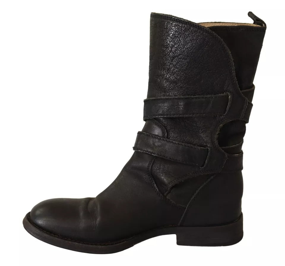 Experience the allure of Dolce & Gabbana's Black Leather Buckle Mid Calf Boots, where exquisite craftsmanship meets timeless elegance for the discerning individual.