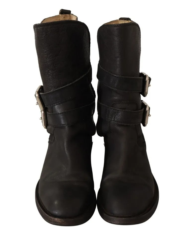 Step into elegance with Dolce & Gabbana's Black Leather Buckle Mid Calf Boots, where exquisite craftsmanship meets timeless allure for the discerning individual.