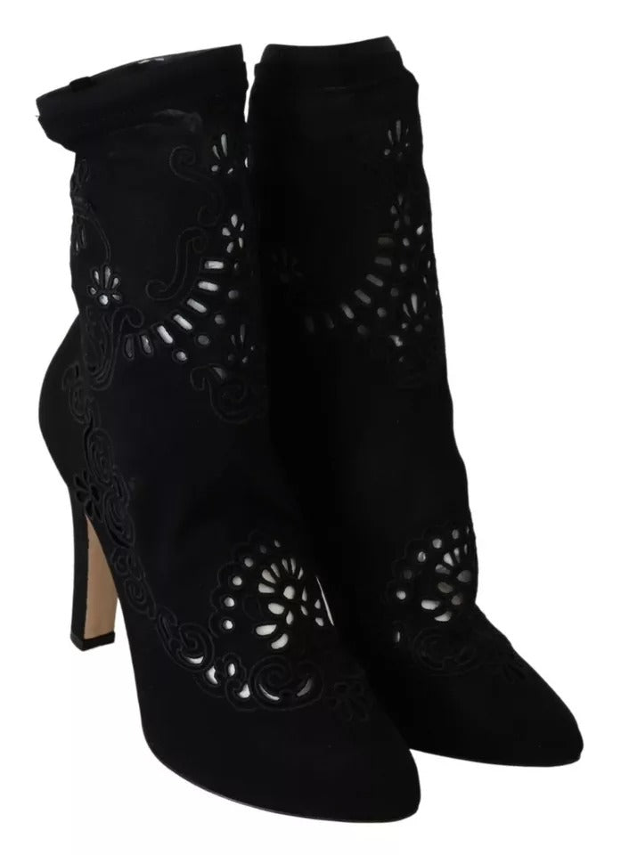 Experience the exquisite Dolce & Gabbana Black Stretch Pumps, crafted from luxurious viscose and elastane, embodying timeless elegance and sophisticated allure for any occasion.