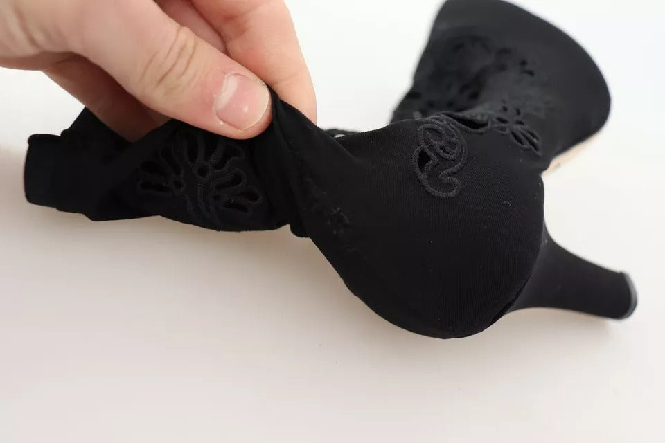 Step into the realm of elegance with Dolce & Gabbana Black Stretch Pumps, where luxurious floral lace meets Italian craftsmanship, perfect for any sophisticated affair.