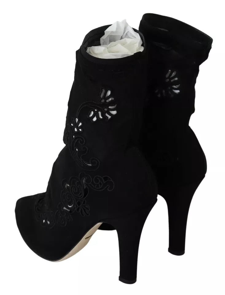 Elevate your style with Dolce & Gabbana's Black Stretch Pumps, where exquisite floral lace meets luxurious craftsmanship, embodying timeless elegance for the discerning individual.