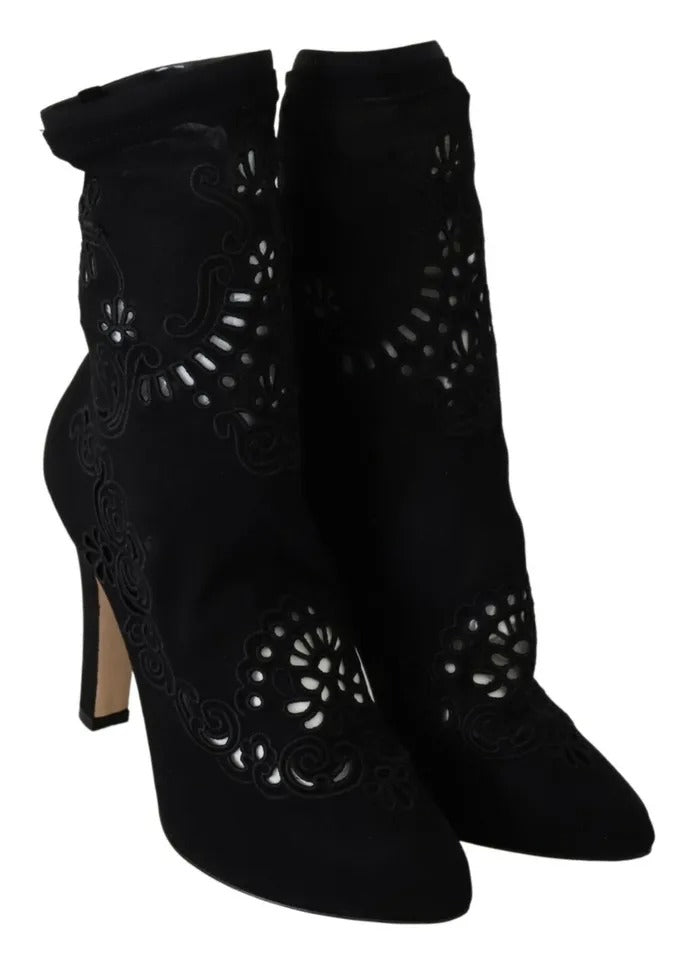 Experience the allure of Dolce & Gabbana's Black Stretch Pumps, where exquisite floral lace meets luxurious craftsmanship, perfect for the discerning individual.
